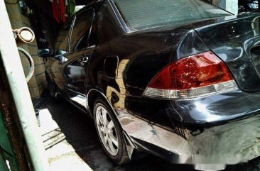 Selling Black Mitsubishi Lancer 2010 Manual Gasoline at 115000 km 