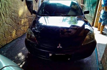 Selling Black Mitsubishi Lancer 2010 Manual Gasoline at 115000 km 