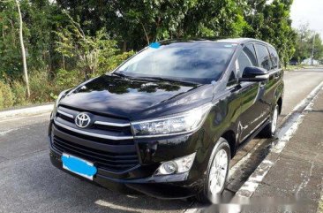 Selling Black Toyota Innova 2017 at 35000 km