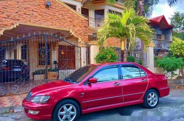 Selling Red Mitsubishi Lancer 2003 at 100000 km 