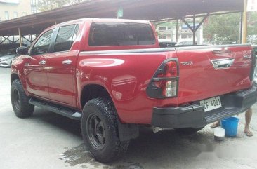 Red Toyota Hilux 2016 at 20000 km for sale