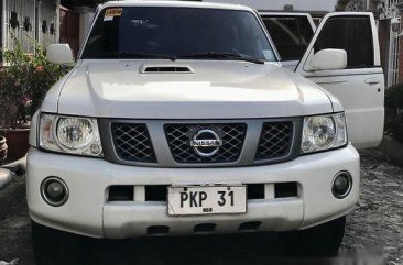 White Nissan Patrol 2013 at 157000 km for sale 