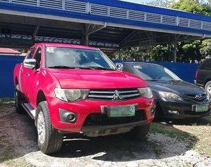 Red Mitsubishi Strada 2011 at 67000 km for sale 