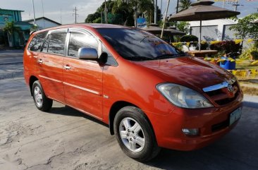 Orange Toyota Innova 2005 for sale in Manila