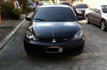 Sell Black 2009 Mitsubishi Lancer in Quezon City