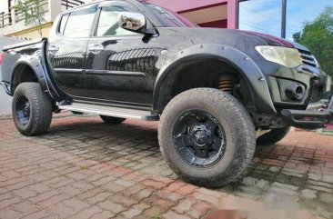 Sell Black 2012 Mitsubishi Strada in Bamban