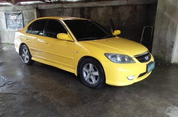 Yellow Honda Civic 2004 for sale in Sta. Rosa-Nuvali Rd.