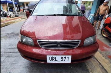 Selling Red Honda Odyssey in Rodriguez