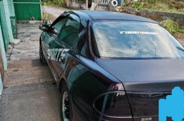 Black Mazda Protege for sale in Dau