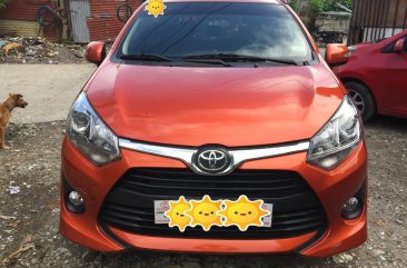 Selling Orange Toyota Wigo in Dasmariñas