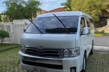 White Toyota Hiace Super Grandia for sale in Streetscape