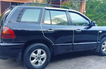 Black Hyundai Santa Fe 2014 for sale in Davao 