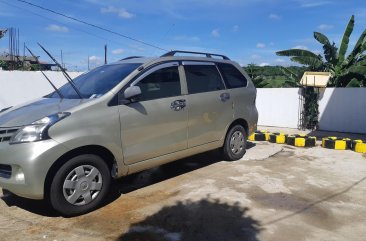 Selling Gold Toyota Avanza 2013 Van in Cavite City