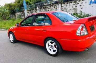 Red Mitsubishi Lancer for sale in Quezon City