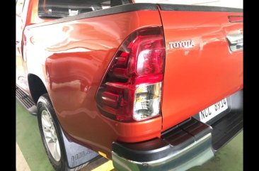 Orange Toyota Hilux 2018 at 27364 km for sale in Manila