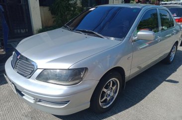 Sell Pearl White Mitsubishi Lancer in Quezon City