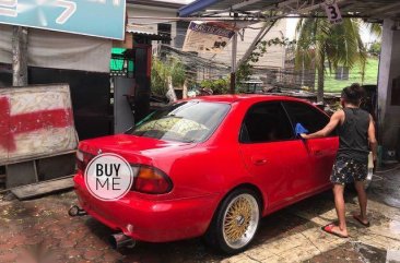 Red Mazda 323 1996 for sale in Quezon City