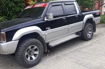 Selling Black Mitsubishi Strada 1995 in Davao