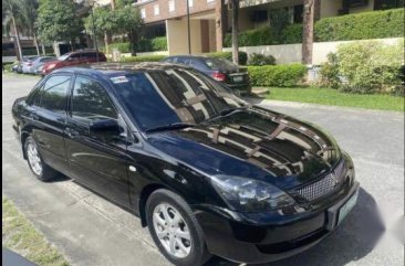 Black Mitsubishi Lancer 2011 for sale in Quezon