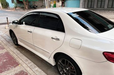 Pearl White Toyota Corolla Altis 2010 for sale in Quezon