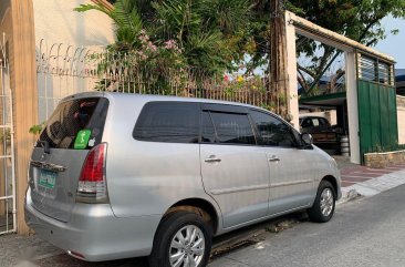 Silver Toyota Innova 2011 