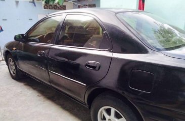 Black Mazda 323 1997 for sale in Parañaque