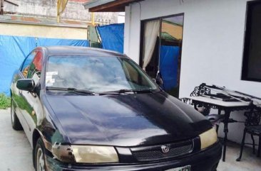 Black Mazda 323 1997 for sale in Parañaque