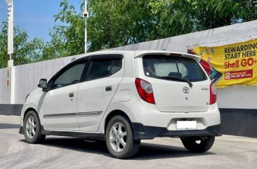 Selling Pearl White Toyota Wigo 2014 in Makati