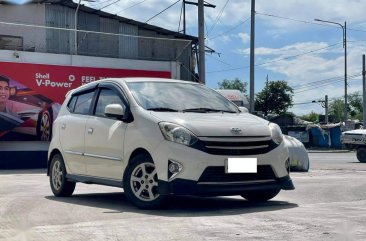 Selling Pearl White Toyota Wigo 2014 in Makati