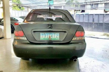 Selling Greyblack Mitsubishi Lancer 2011 in Quezon City