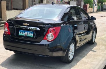 Black Chevrolet Sonic 2013 for sale in Samal