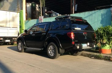 Selling Black Mitsubishi Strada 2010 in Quezon