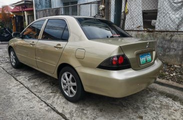 Selling Golden Mitsubishi Lancer 2010 in Imus