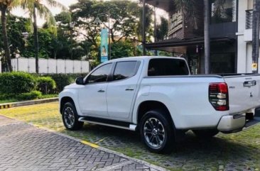 Pearl White Mitsubishi Strada 2019 for sale in Quezon 