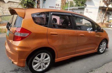 Orange Honda Jazz 2013 for sale in Quezon City