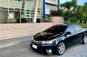 Sell Black 2014 Toyota Corolla altis in Quezon City