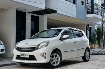 Selling White Toyota Wigo 2015 in Quezon City