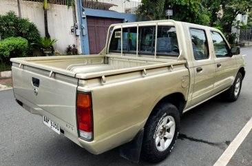 Sell Bronze 2014 Nissan Frontier in Quezon City