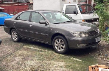 Selling White Mazda 2 2005 in Pasay