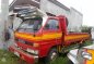 Isuzu Elf 4BC1 14ft Dropside Red Truck For Sale -0