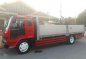 Isuzu Forward Dropside 21ft 6HE1 Red For Sale -1