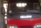 Isuzu Elf Dropside 12ft MT Red Truck For Sale -0