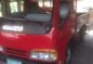 Isuzu Elf Dropside 12ft MT Red Truck For Sale -1