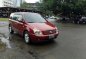 2010 Kia Carnival AT Red SUV For Sale -0