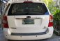 Kia Carnival EX 2009 AT White Van For Sale -0