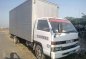 isuzu Dropside Elf 2004 4be1 NPR 14ft Self loader forward-2