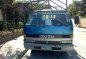 Isuzu ELF NPR Dropside Blue Truck For Sale -0