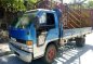 Isuzu ELF NPR Dropside Blue Truck For Sale -1