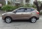 Hyundai Tucson 2012 Gasoline Automatic Brown-5