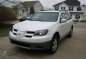 Looking for 2004-2005 Mitsubishi Outlander AT-2